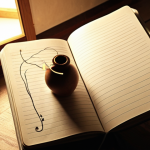 **Prompt:** A person is writing in a simple notebook by soft, ambient light, representing a dream journal. Around them, subtle, flowing lines and abstract symbols emerge, forming a pathway into deep, mysterious corridors, illustrating the exploration of the subconscious mind and self-discovery. The mood is introspective and calm.
